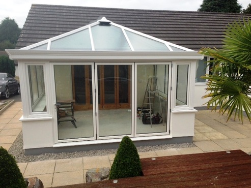 white Edwardian conservatory with bifold doors